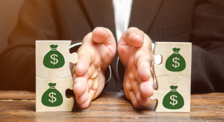 Hands Dividing Blocks Symbolizing Money