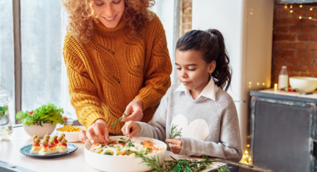 Happy Woman and girl Making Food