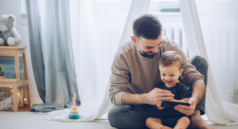 Father with son watching ipad