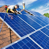 Solar panels getting installed on a roof.