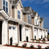 A row of identical suburban homes.