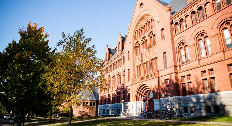 Outside shot of a large brick and stone college building.