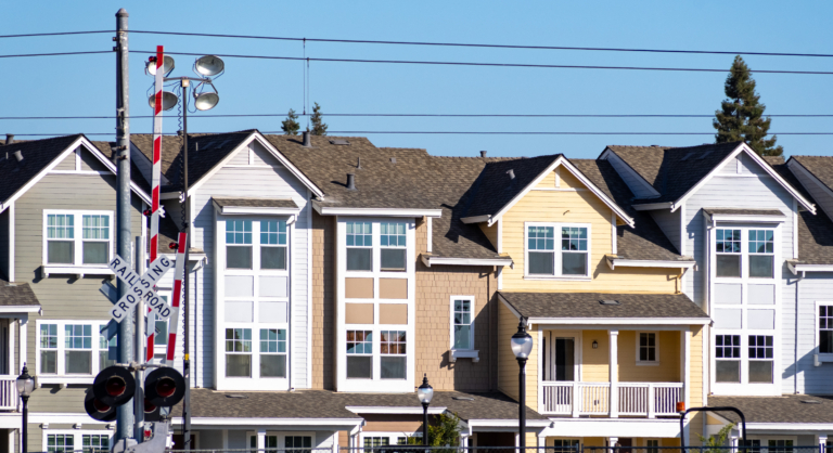 multifamily residential buildings built next to railroad tracks