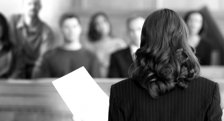 Female attorney addressing a jury.
