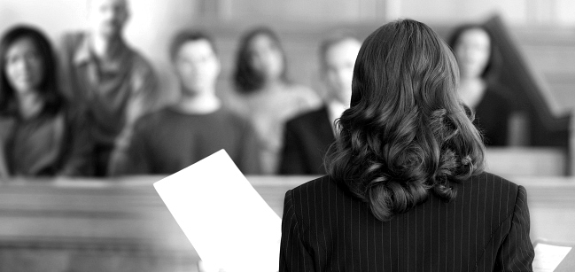 Female attorney addressing a jury.