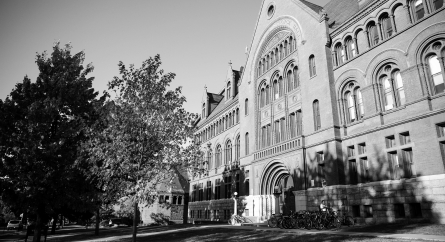 Outside shot of a large brick and stone college building.