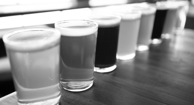 Line of glasses of different beers.