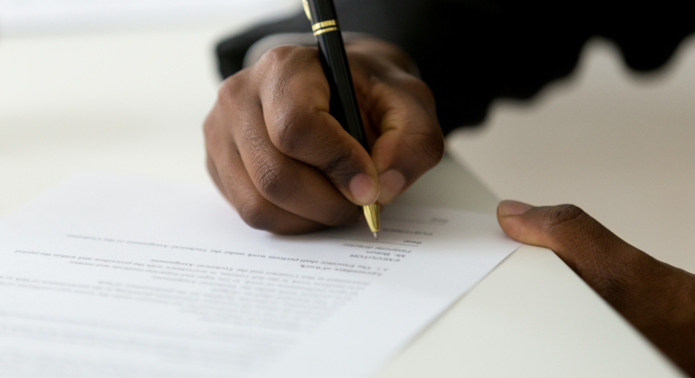 Individual signing a document