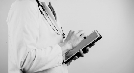Doctor holding a tablet.