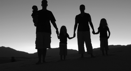 Silhouette of a family at sunset.
