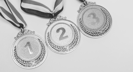 First, second, and third place medals.