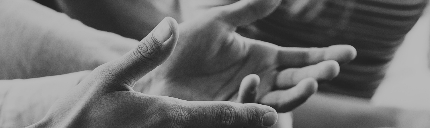 Close-up of hands gesturing as someone is talking.