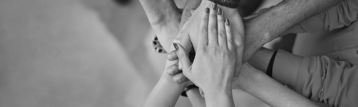 Team with their hands stacked together.