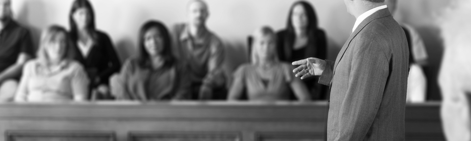 Male attorney addressing a jury.