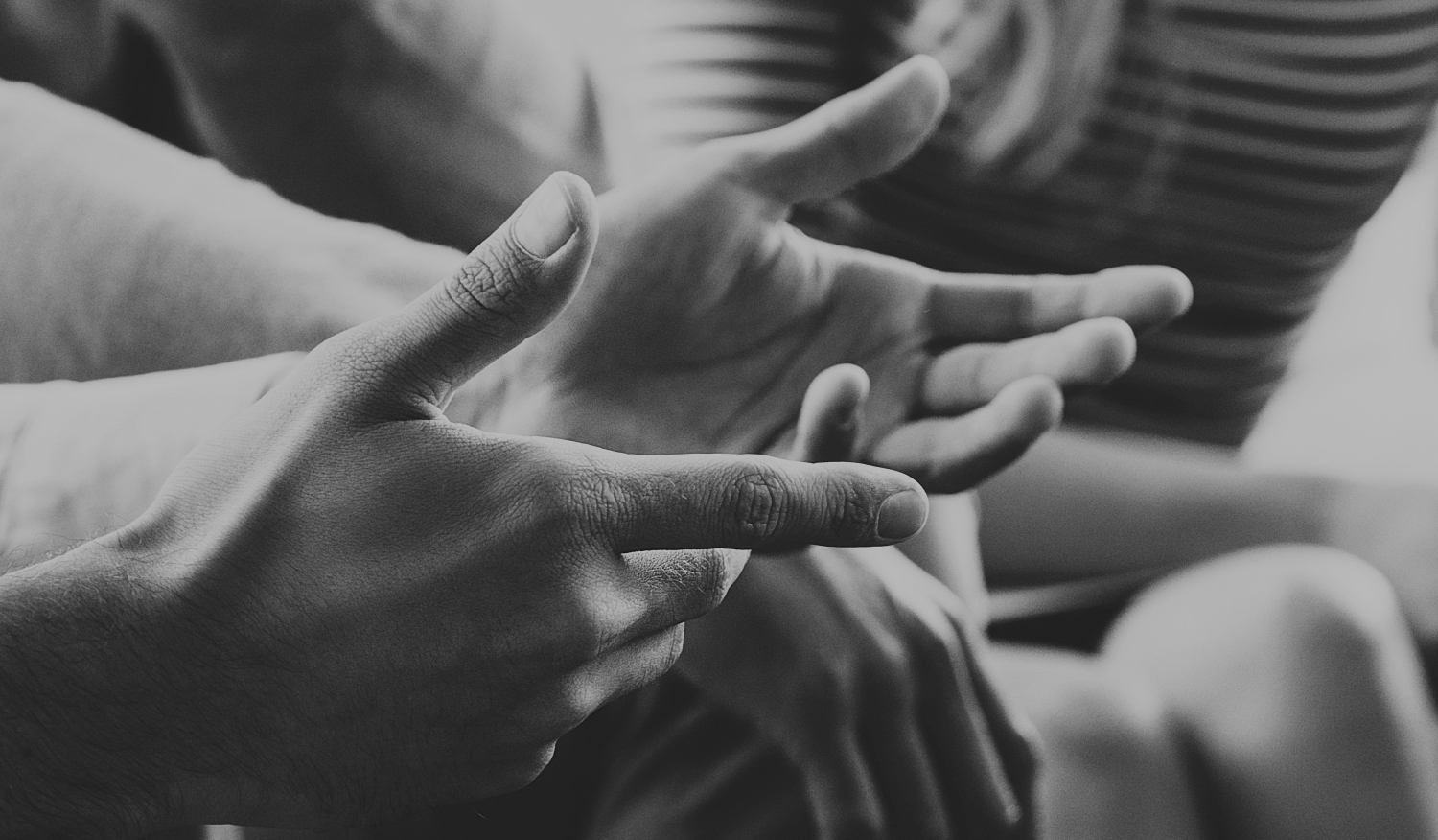 Close-up of hands gesturing as someone is talking.