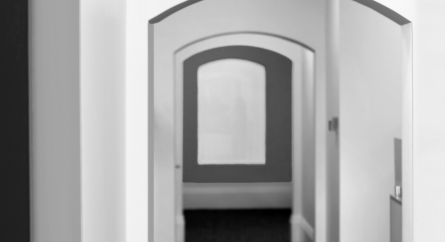 Empty arched hallway.