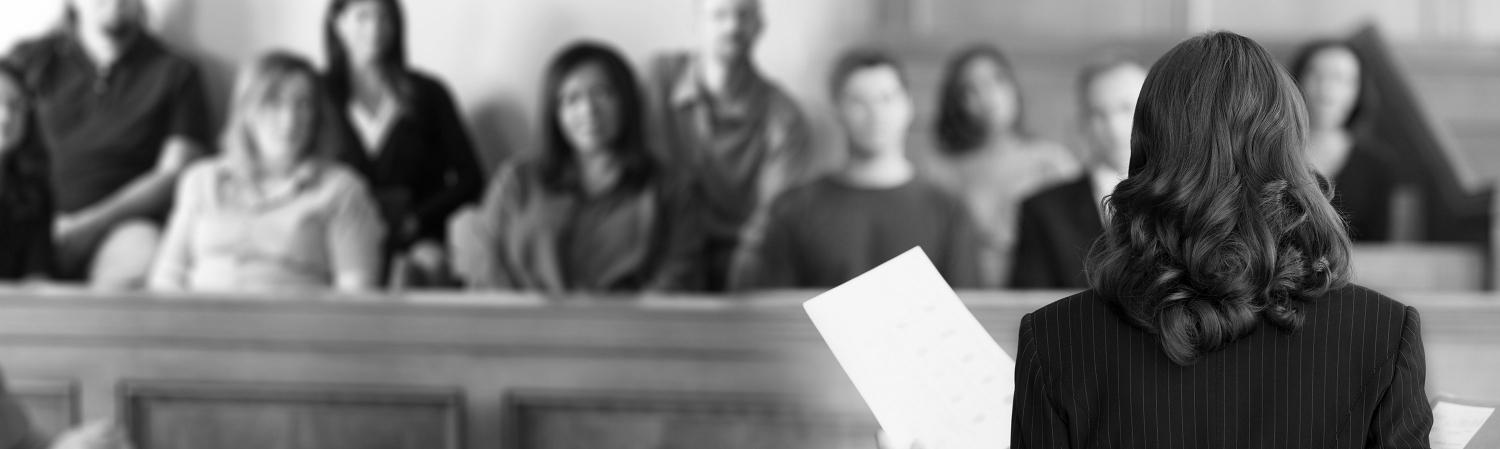 Female attorney addressing a jury.