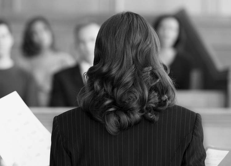 Female attorney addressing a jury.