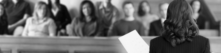 Female attorney addressing a jury.