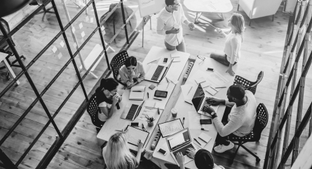 Top view of diverse young creative people in a modern office working together.