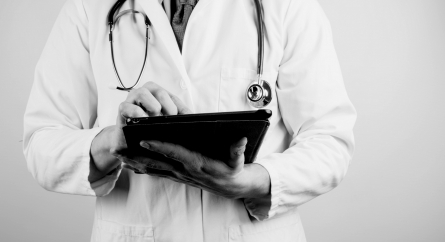 Doctor holding a tablet.