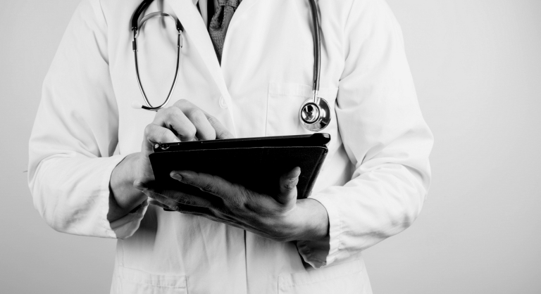 Doctor holding a tablet.