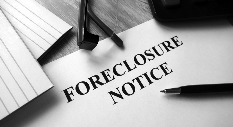 Close-up of paper that says foreclosure notice in all caps.