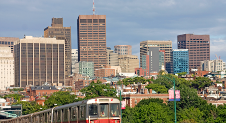 Boston cityscape with the T in the foreground.